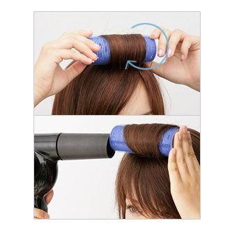 点击大图看下一张：用左手将发尾处的头发顺着卷发夹的表面压住，再朝着发根的方向向内卷进。