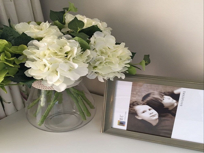 点击大图看下一张：温润清新田园二居室别致装潢