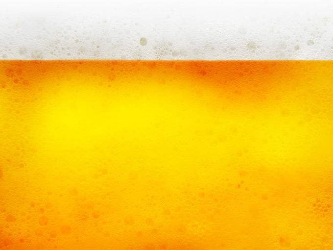 点击大图看下一张：黄色啤酒液体创意背景高清图片