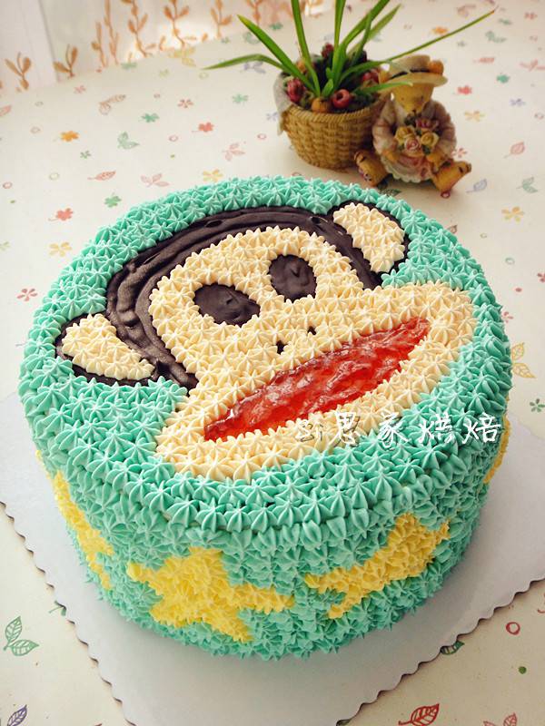 点击大图看下一张：大嘴猴卡通生日蛋糕图片