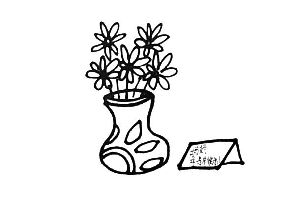 第五步：在花瓶旁边画上一张贺卡，并且写上母亲节快乐。