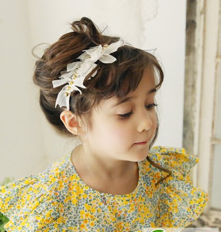 点击大图看下一张:幼儿园女孩发型扎法图片