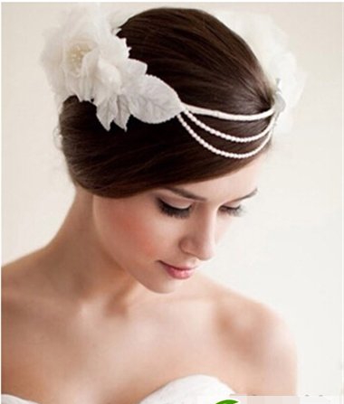 点击大图看下一张：经典新娘发型图片 花苞头盘发高贵优雅