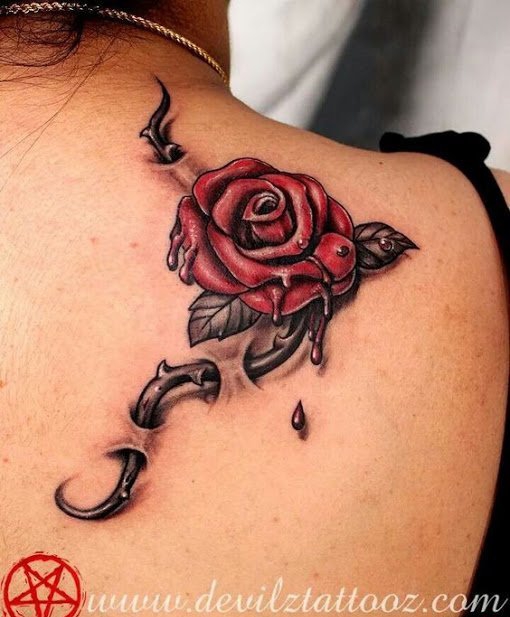 点击大图看下一张：女孩身上漂亮的玫瑰花纹身图片