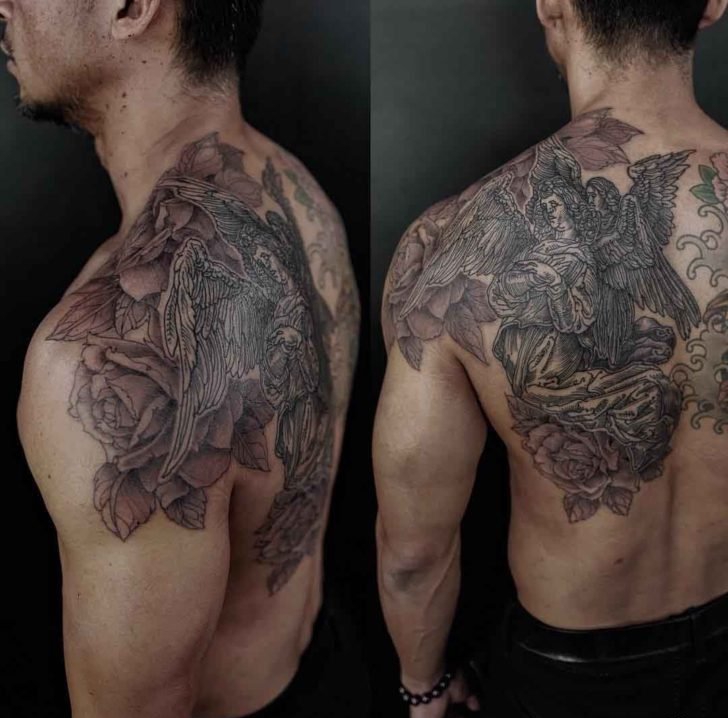 点击大图看下一张：男子背部帅气的黑灰色天使纹身图片