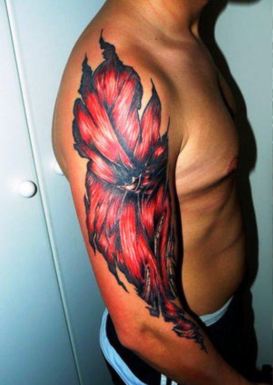 点击大图看下一张:男性血腥的肌肉外露纹身图案