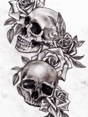 黑灰色玫瑰花和骷髅头纹身图片手稿