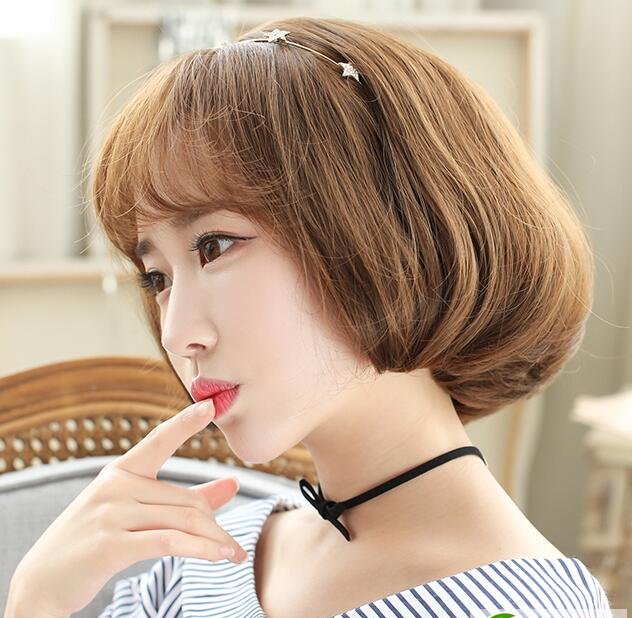 点击大图看下一张：亚麻色梨花头短卷发