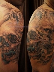 手臂经典潮流的一张骷髅与狐狸纹身图案