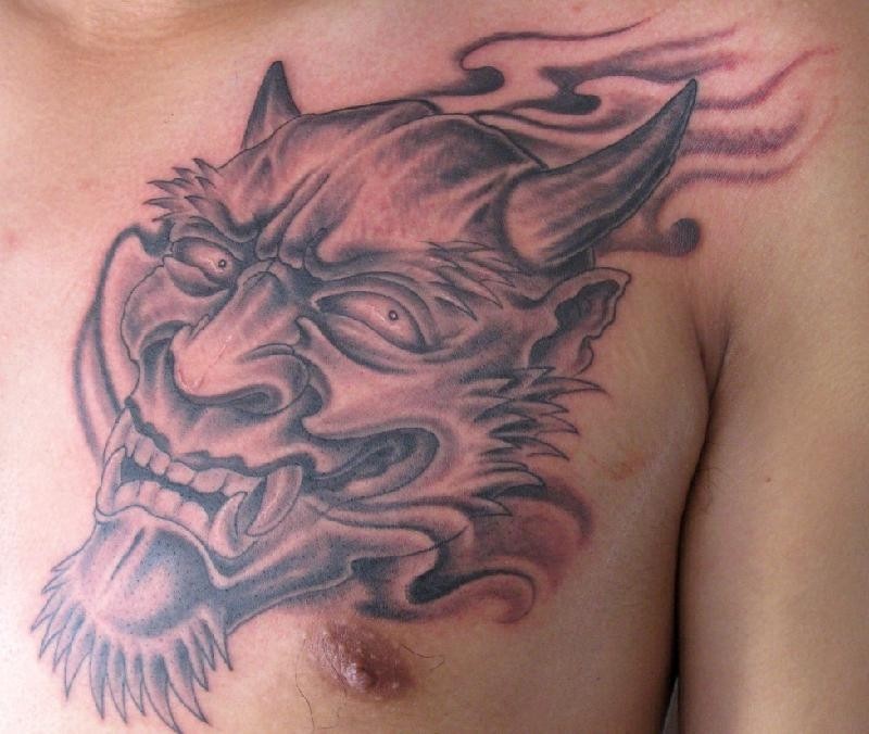 点击大图看下一张：肌肉男胸堂恐怖撒旦头像纹身图片