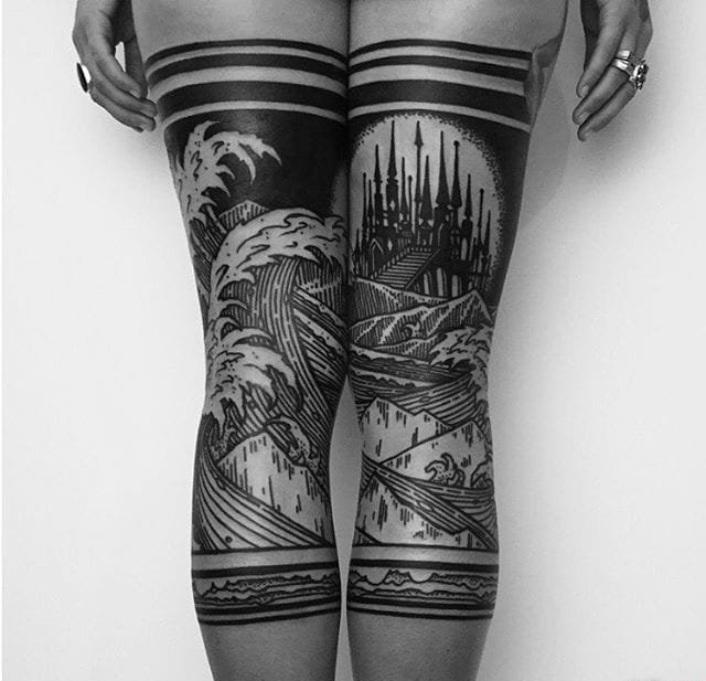 点击大图看下一张：霸气的黑色花臂花腿纹身图案