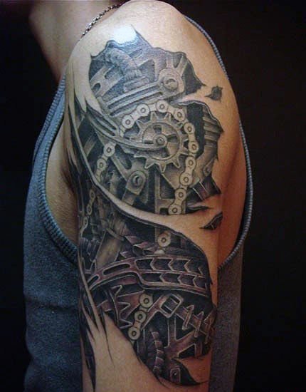 点击大图看下一张：让人感觉无比有力的男性生物机械花臂纹身图案