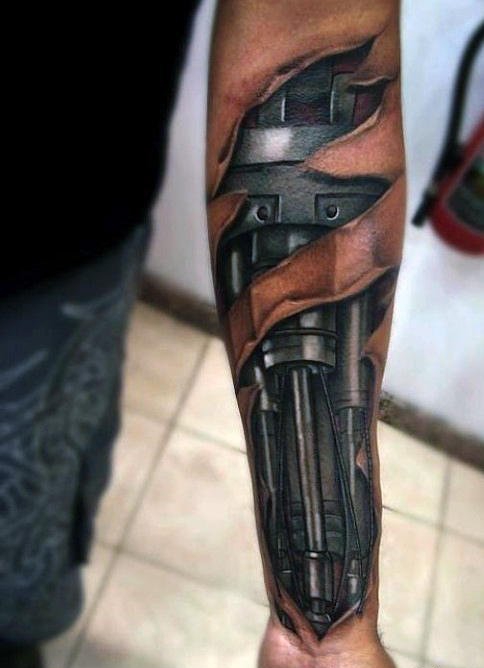 点击大图看下一张：让人感觉无比有力的男性生物机械花臂纹身图案