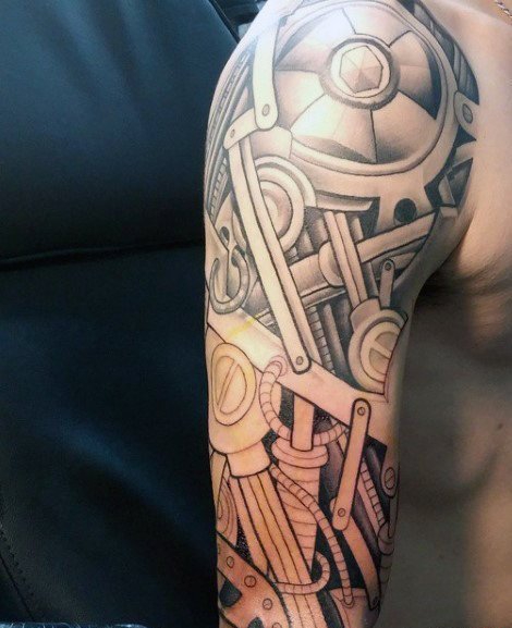 点击大图看下一张：让人感觉无比有力的男性生物机械花臂纹身图案