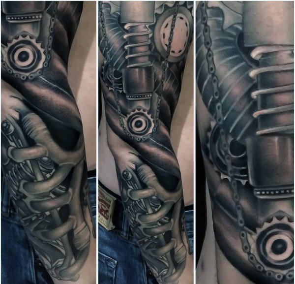 点击大图看下一张：让人感觉无比有力的男性生物机械花臂纹身图案