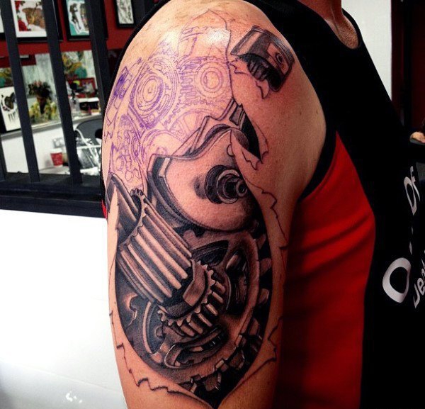 点击大图看下一张:让人感觉无比有力的男性生物机械花臂纹身图案