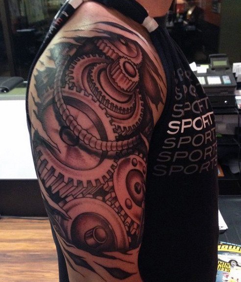 点击大图看下一张:让人感觉无比有力的男性生物机械花臂纹身图案