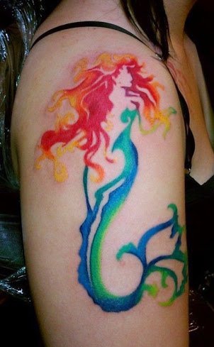 点击大图看下一张:漂亮性感女孩身上美丽的美人鱼纹身图案鱼