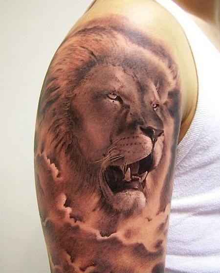 点击大图看下一张：大臂狮子头纹身图案图片