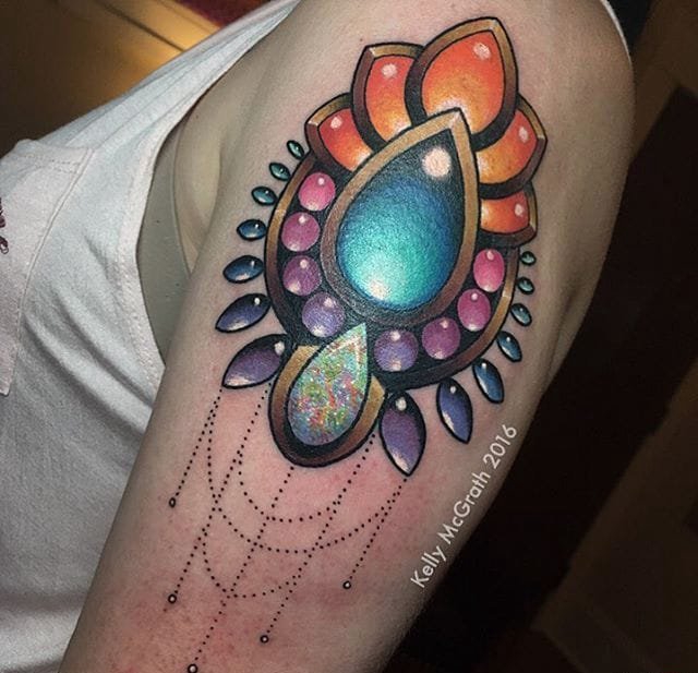 点击大图看下一张:彩色的光芒四射的宝石水晶纹身图案来自凯利