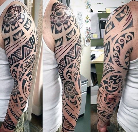 点击大图看下一张：男性强壮有力的花臂部落图腾纹身图案