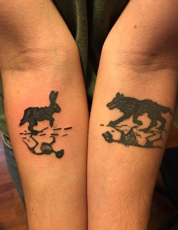 点击大图看下一张：左右手臂内侧黑色长耳朵兔子纹身狼纹身图片