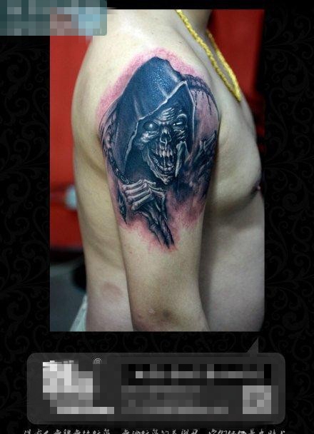 点击大图看下一张：手臂霸气超酷的黑灰死神纹身图案