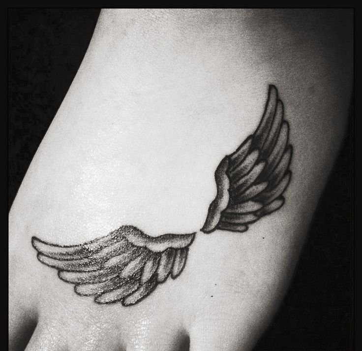 点击大图看下一张:女性身上漂亮的天使翅膀纹身图案欣赏