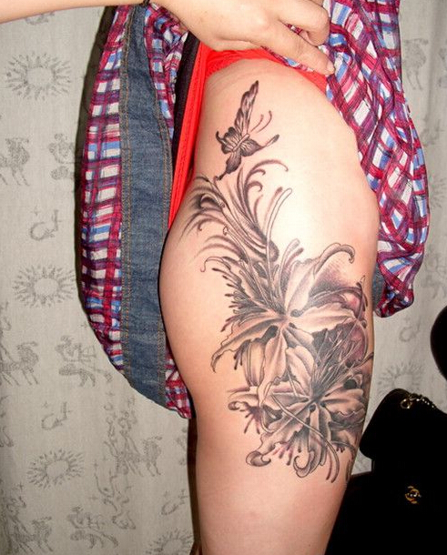 点击大图看下一张：美女大腿上漂亮的蝴蝶花朵刺青