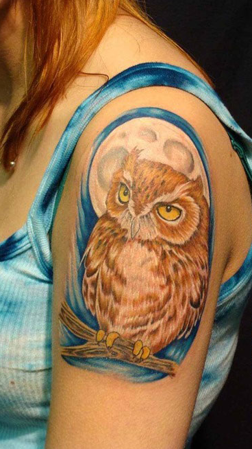 点击大图看下一张：肩膀的桔色猫头鹰纹身