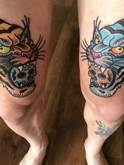 双大腿上的老虎和嘴里的骷髅头纹身图片