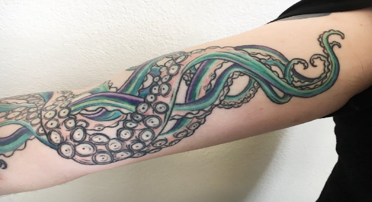 点击大图看下一张：花臂上的美人身章鱼尾纹身图片