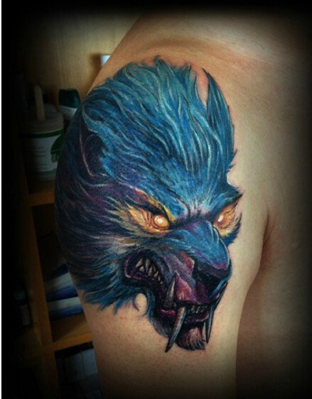 点击大图看下一张：手臂上超酷凶恶的狼头纹身图案