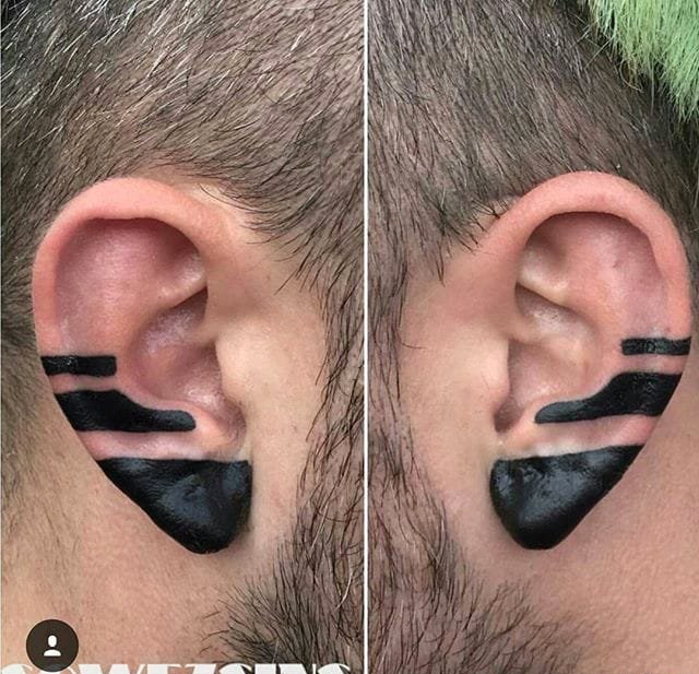 点击大图看下一张：黑色面部个性纹身耳朵上线条几何纹身图案