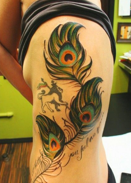 点击大图看下一张：腰部好看孔雀羽毛纹身图案