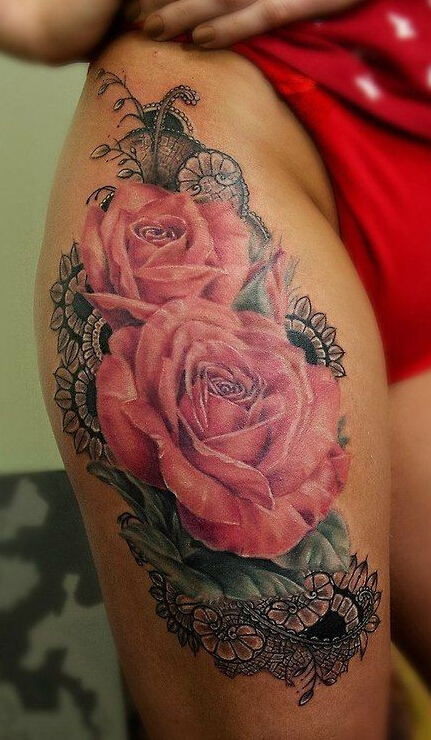 点击大图看下一张：大腿盛开的玫瑰花纹身图案