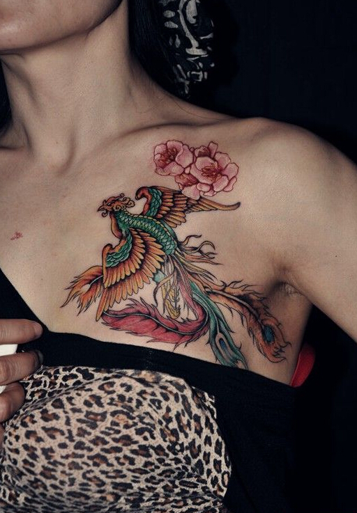 点击大图看下一张：女性小臂漂亮的火凤凰花朵纹身图案