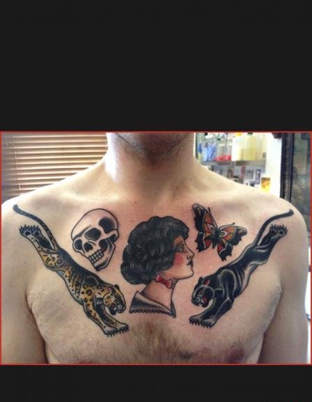 点击大图看下一张：男性胸部霸气的大面积传统纹身动物图案纹身