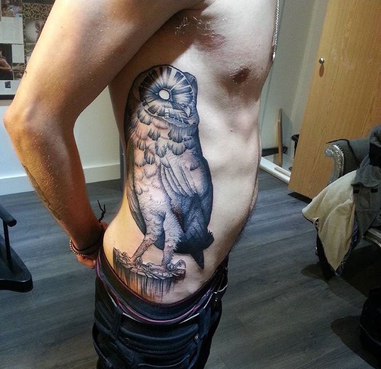 点击大图看下一张：男士侧肋纹身动物几何元素纹身点刺技巧纹身图案