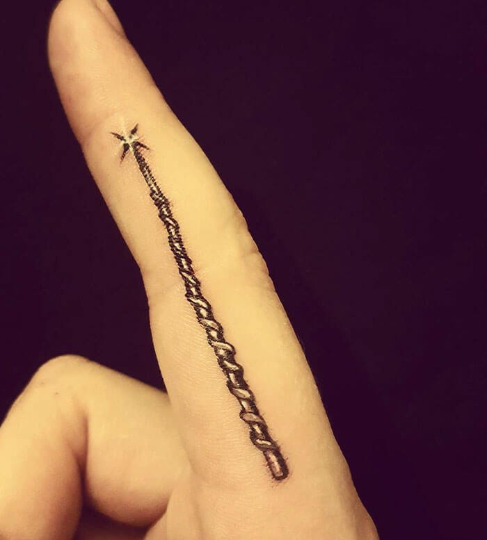 点击大图看下一张:哈利波特系列几何元素简约线条纹身图案