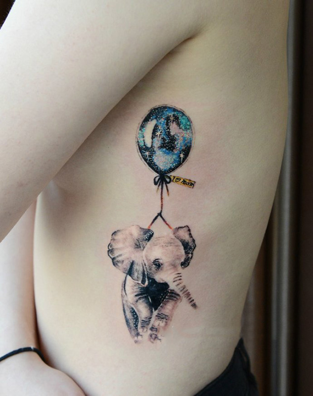点击大图看下一张：侧肋星空气球与可爱的小象纹身图案