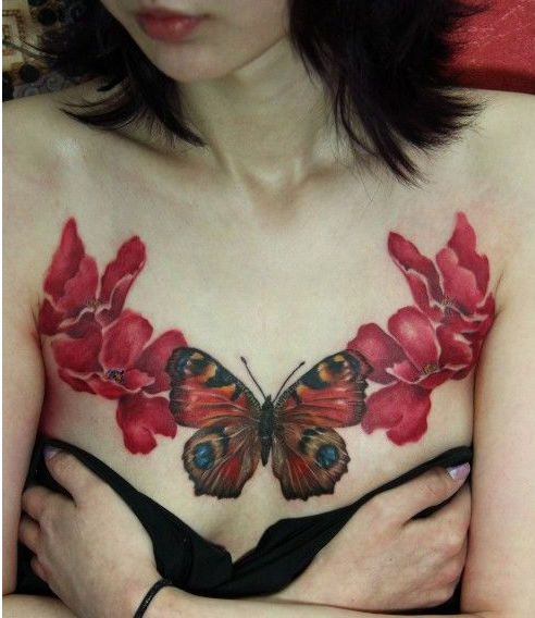 点击大图看下一张：美女胸部盛开的花朵和蝴蝶纹身图案