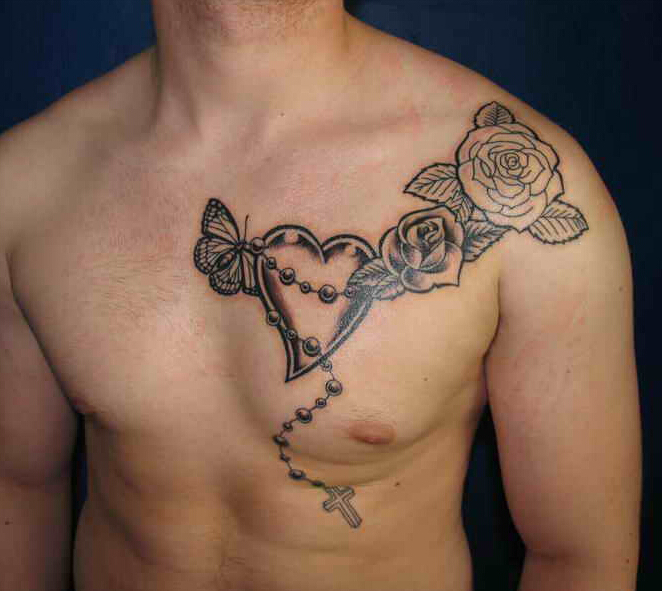 点击大图看下一张：男士胸部心形十字架玫瑰纹身图案