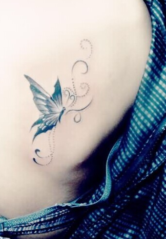 点击大图看下一张：女生最喜爱的蝴蝶背部纹身图案