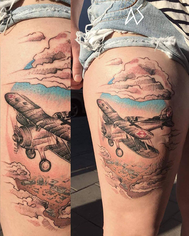 点击大图看下一张：大腿彩绘冲上云霄的飞机创意纹身图案