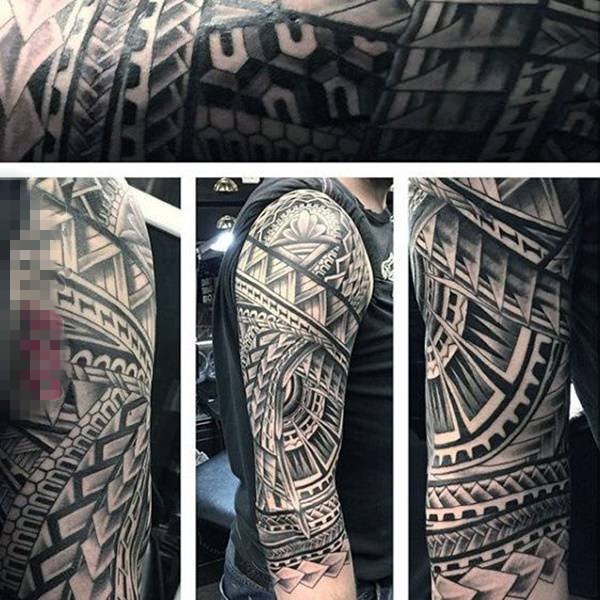 点击大图看下一张：男生霸气黑白花臂纹身图案