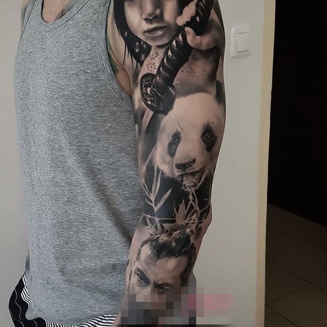 点击大图看下一张：男生手臂上黑色线条素描创意花臂纹身图案