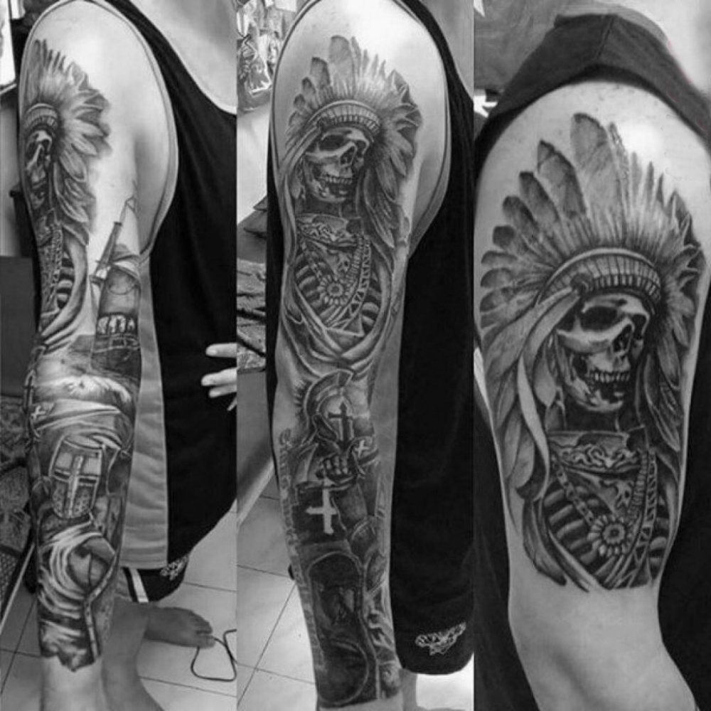点击大图看下一张：男生手臂上黑灰色花臂印第安头饰与骷髅纹身图片