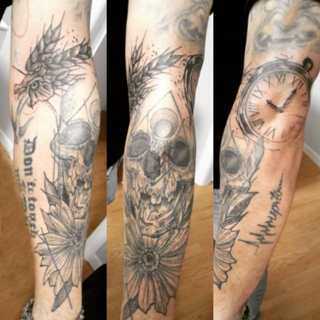点击大图看下一张：男生手臂上黑灰点刺植物花朵和骷髅纹身图片