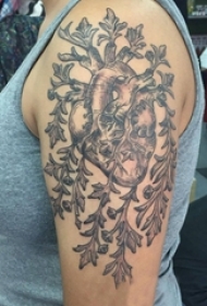 女生手臂上黑灰点刺抽象线条植物和心脏纹身图片